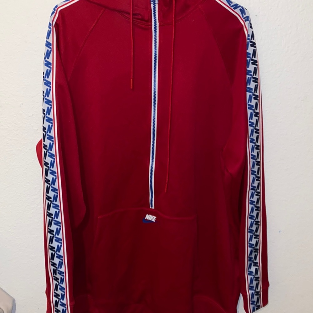All red Nike with Nike designs on the large jacket